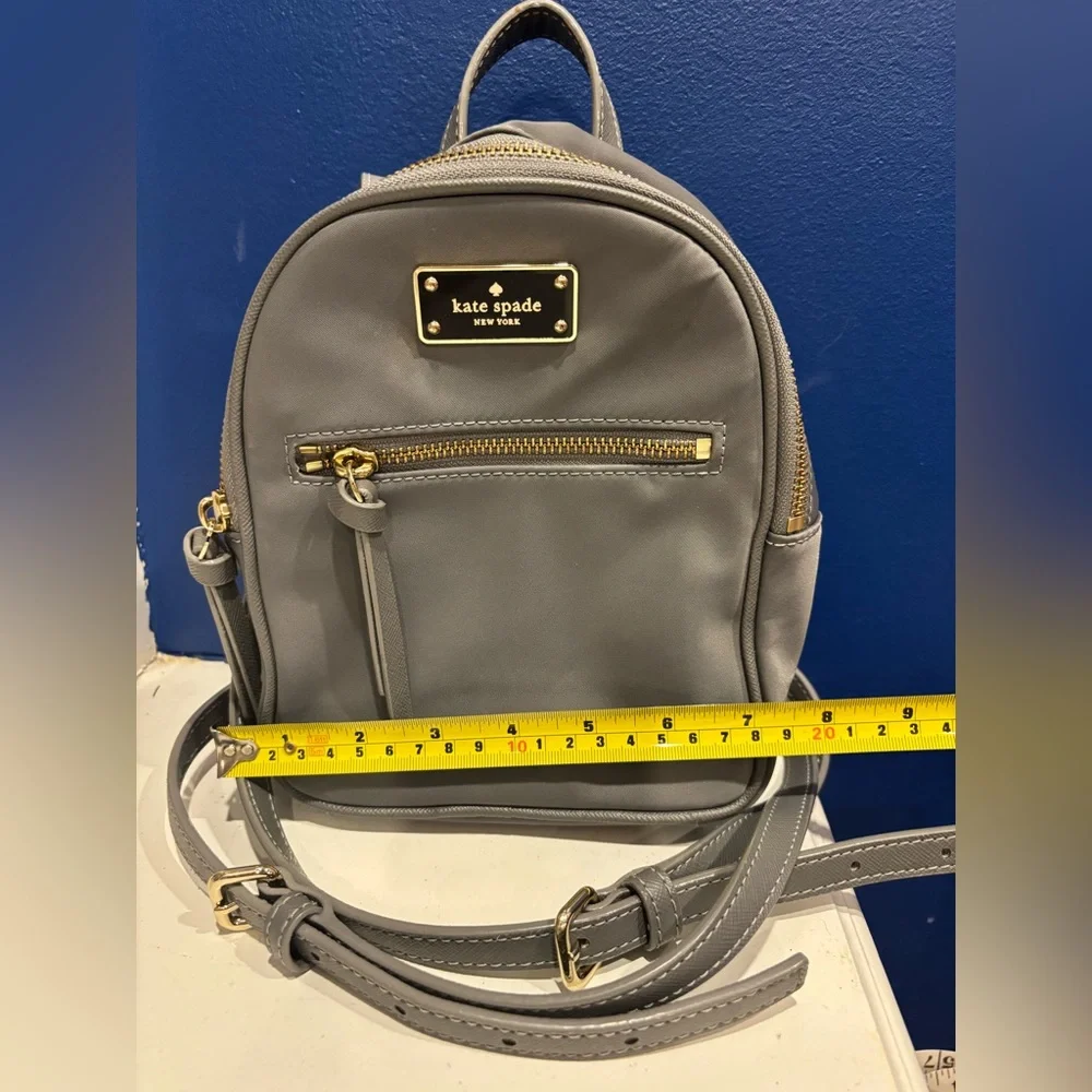 Kate Spade New York Mini Bradley nylon backpack in gray with gold zippers